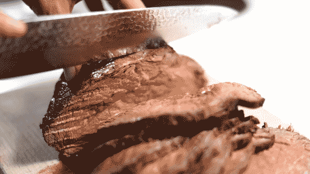 A sharp knife is used to carve meat.