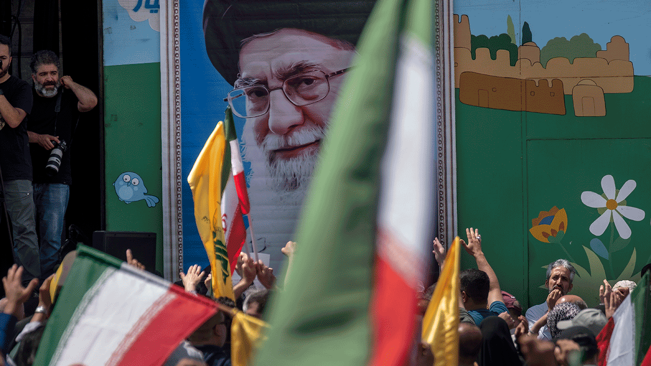 Supreme Leader Ayatollah Ali Khamenei image on the wall during a pro-Iran demonstration