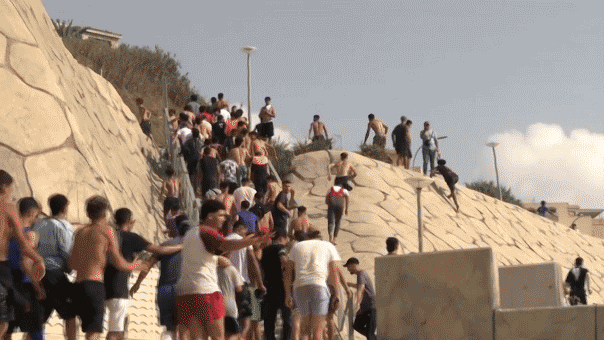 Migrants from Morocco pour into Spain's North African enclave Ceuta on July 30, 2026.